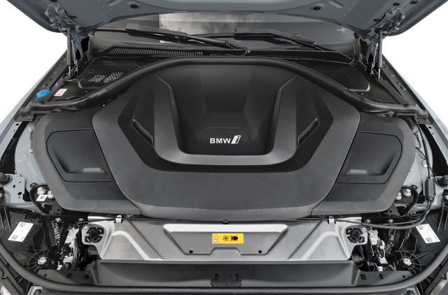 The engine bay of a 2026 BMW i4 M60 showing the EV engine cover with a BMW logo.