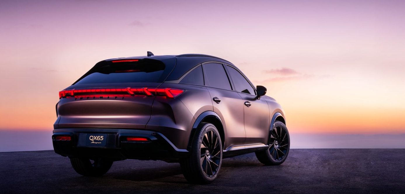 A dark-colored Infiniti QX65 SUV is parked on pavement at sunset, with its rear and side visible against a gradient sky.