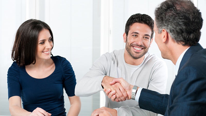 Associate shaking hands with a customer